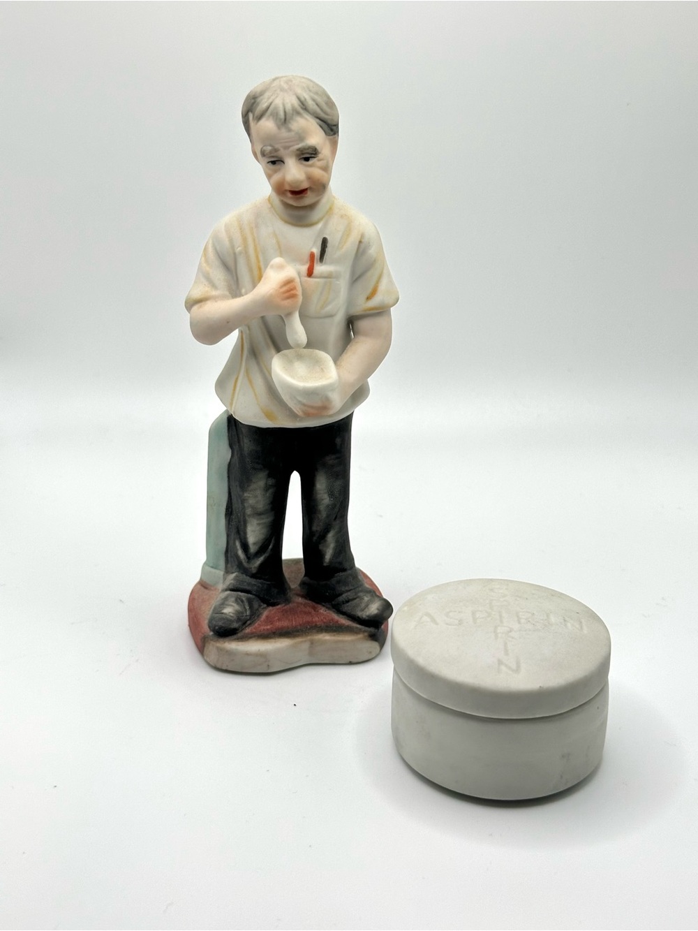 Pharmacist figurine and aspirin lidded container